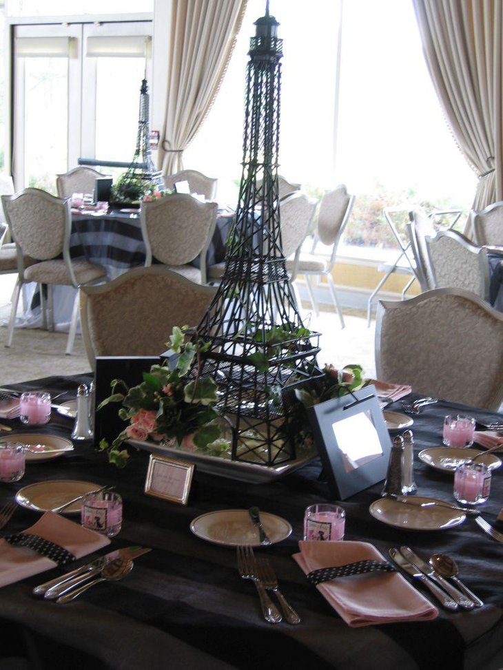 Wedding table decor with a big Eiffel Tower centerpiece