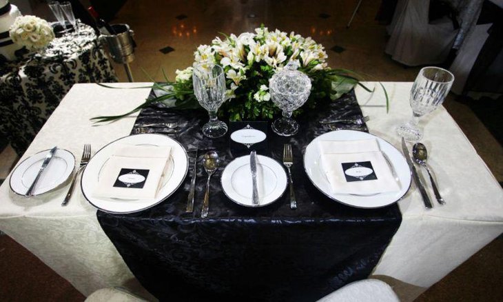Wedding table setting with classy black and white tablecloth