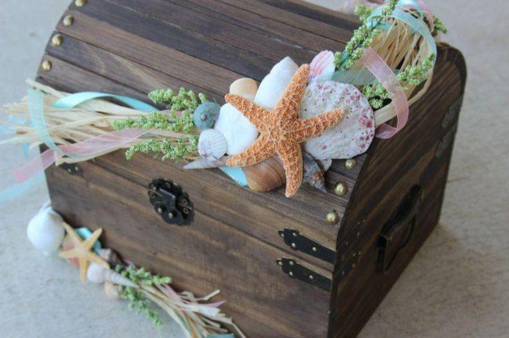 Wedding treasure chest card holder centerpiece with shells and starfish embellishments