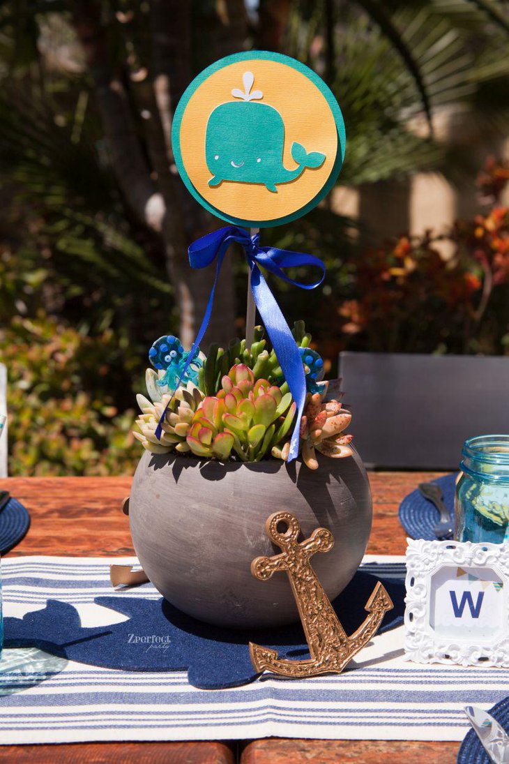 Whale and anchor baby shower table setting with nautical theme