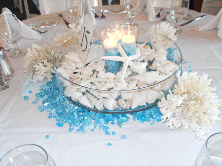 White and blue beach themed candle wedding centerpiece