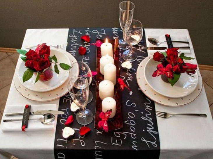 White candles and plates decor on Valentines table