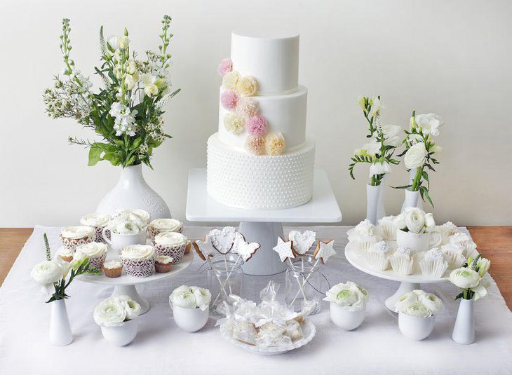 White floral decor on European dessert table
