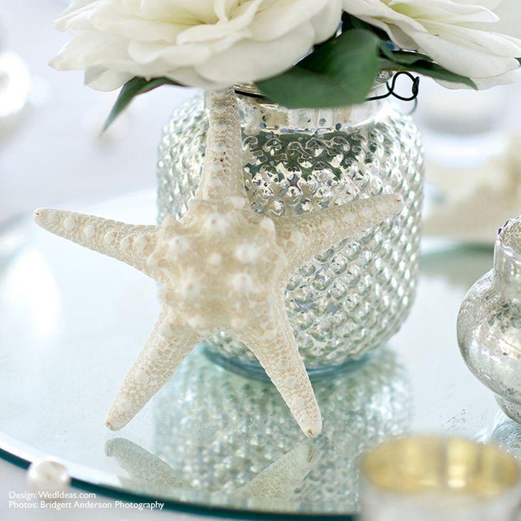 White starfish wedding table centerpiece with flowers