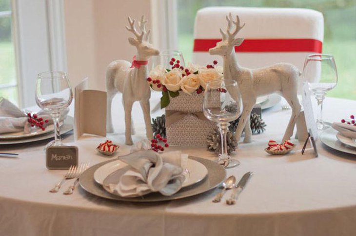 Winter table decor with red berries and pines