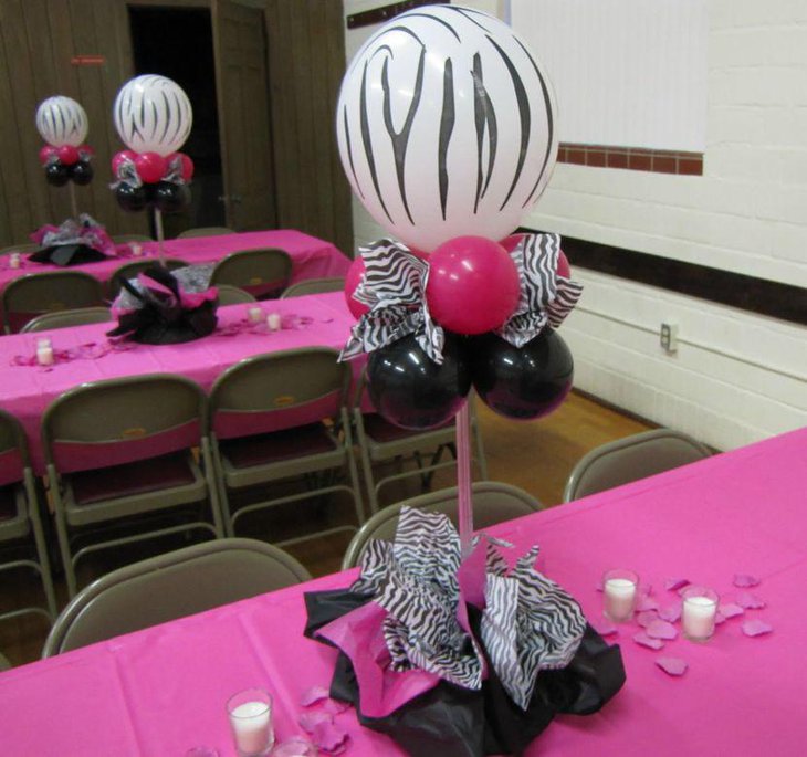 Zebra printed balloon centerpiece on Valentines party table