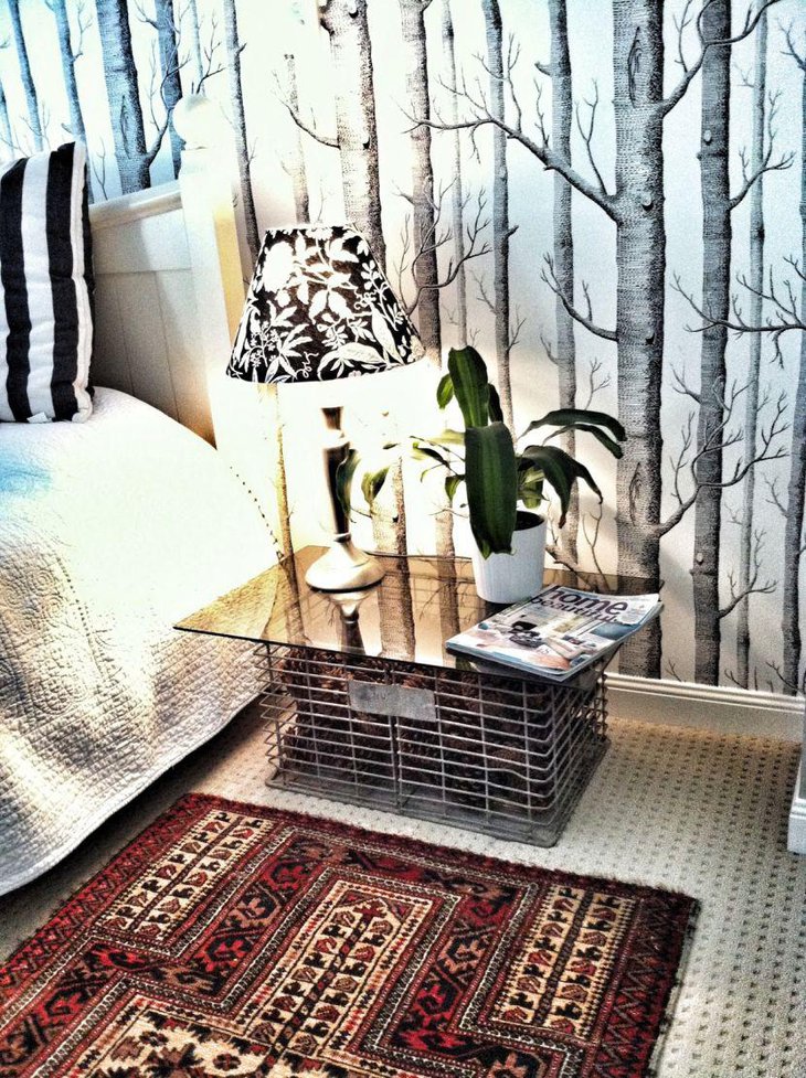 A bedside table made out of an old wire crate