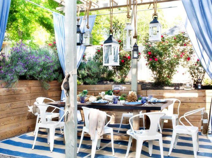 A blue accented beach themed outdoor bridal shower table