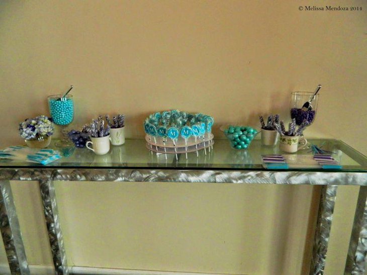 A display of blue candies on a sweet 16 birthday table