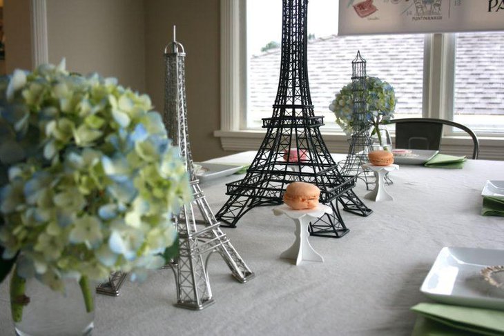 A Paris themed birthday table with Eiffel Tower centerpieces