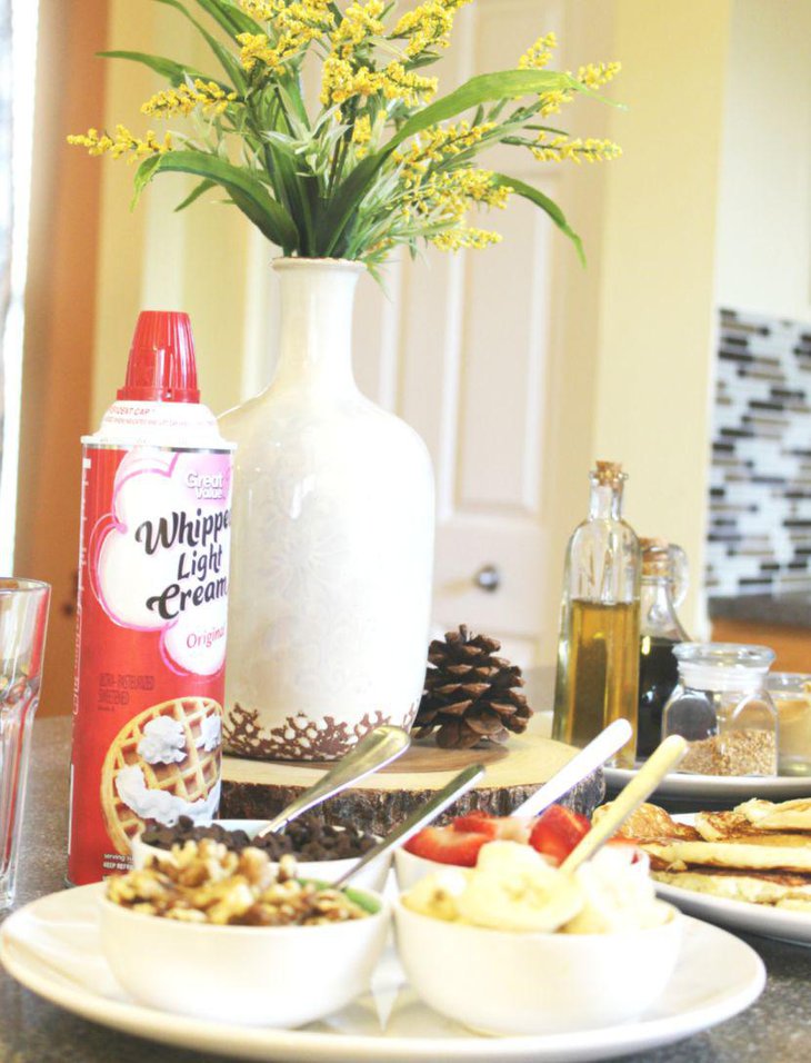 A pine and floral breakfast table centerpiece