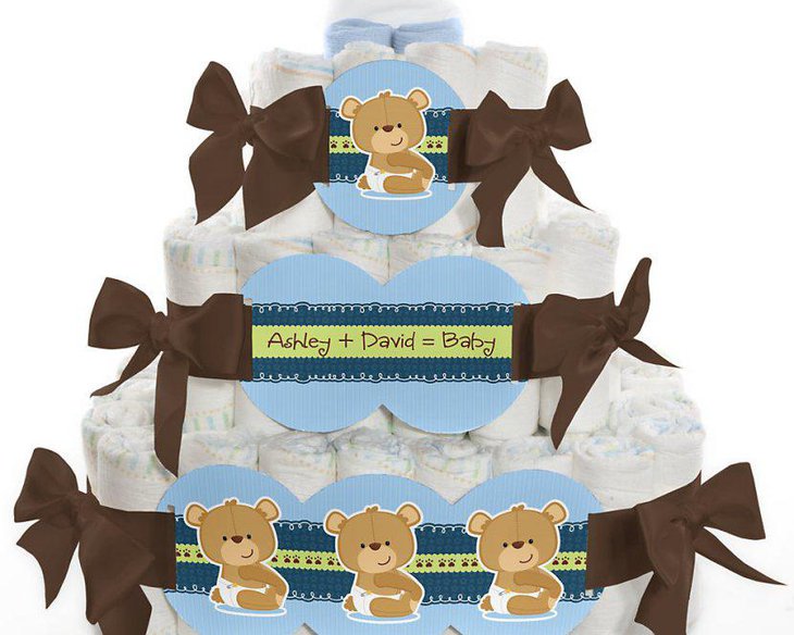 A real teddy bear may be placed on top of the tier along with other baby inspired décor