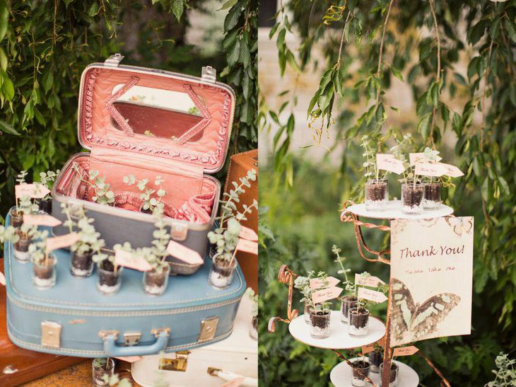 A rustic vintage themed outdoor bridal shower table decked up with makeup vanity and suitcase