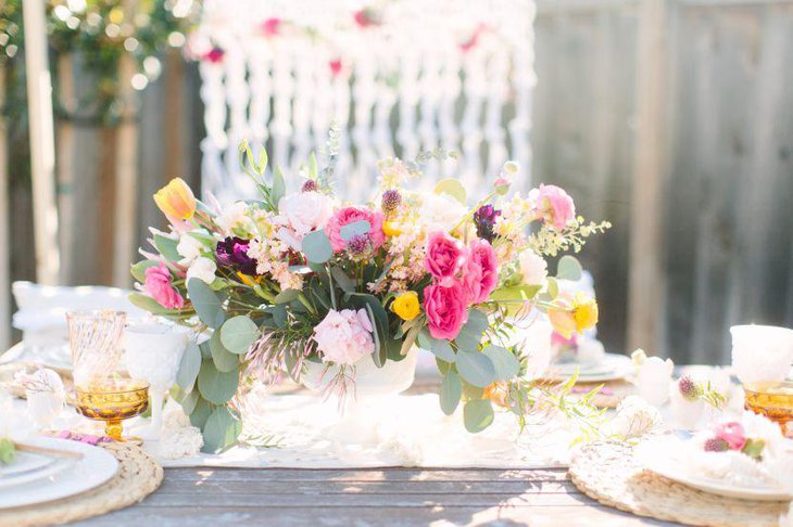 A very colourful spring birthday table decked up with bright flowers