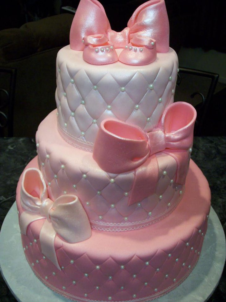 Adorable baby shower satin cake in pink and white