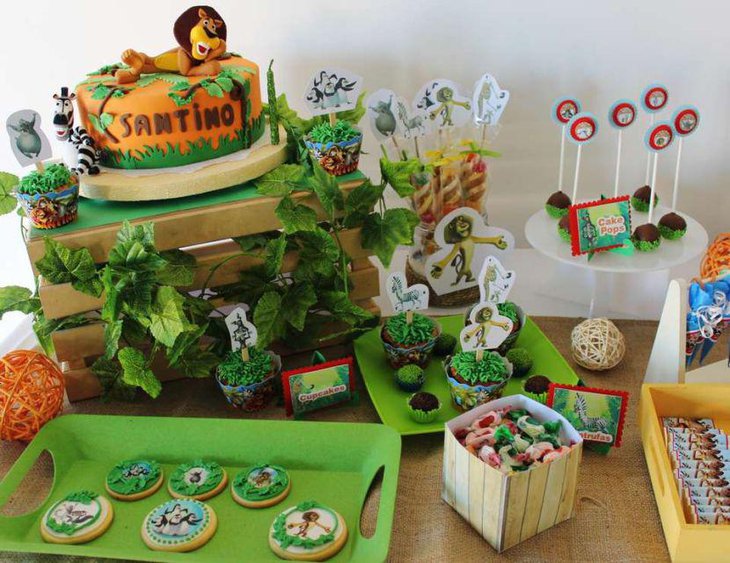 Adorable boys 1st birthday party with Madagascar themed table setting