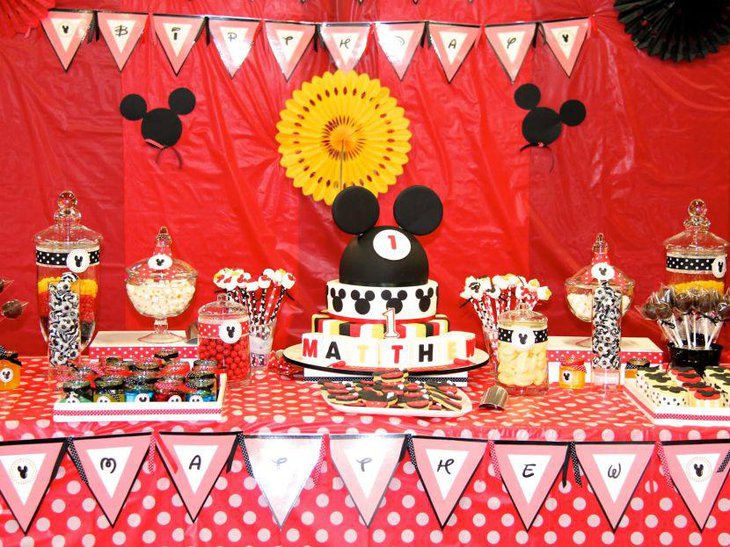 Adorable Mickey Mouse cake decor on birthday table