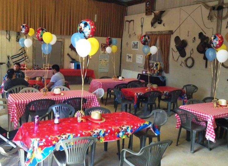 Adorable Mickey Mouse kids birthday table decor with Mickey balloon centerpieces