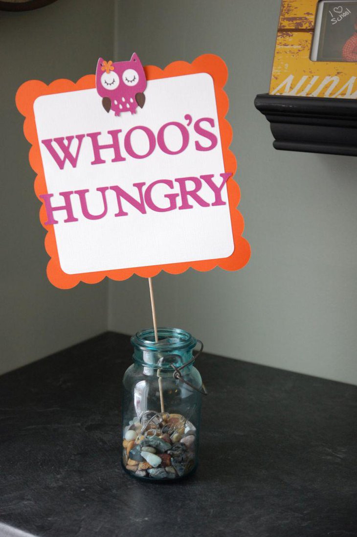 Adorable owl centerpiece on baby shower table