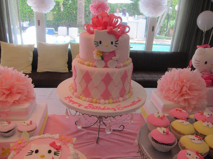 Adorned with pretty pink ribbons a Hello Kitty cake for a baby shower