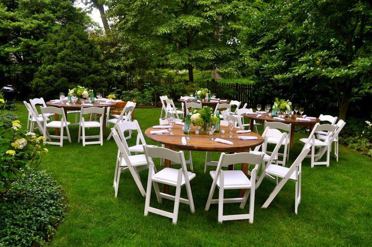 An outdoor bridal shower party tables adorned with fresh flowers