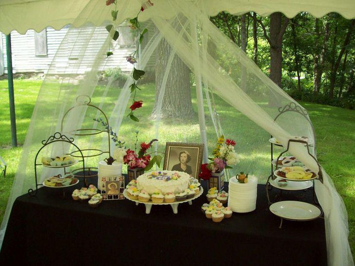 Appealing 80th birthday dessert table decor for a mother