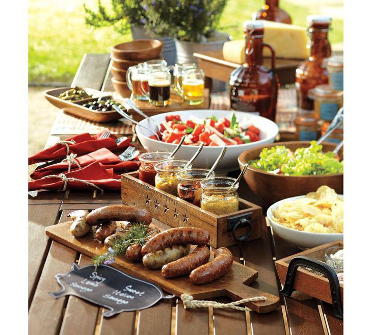 Appetizing food table setting for summer garden party