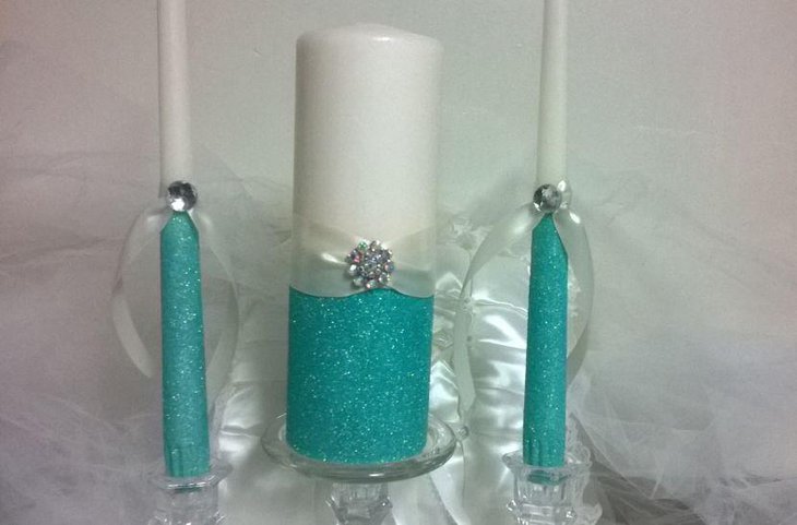 Aqua blue glittery unity candle centerpiece for wedding table