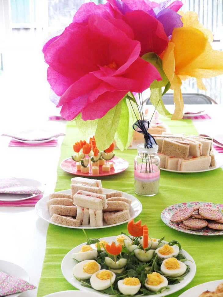 Artificial floral decor on garden party table