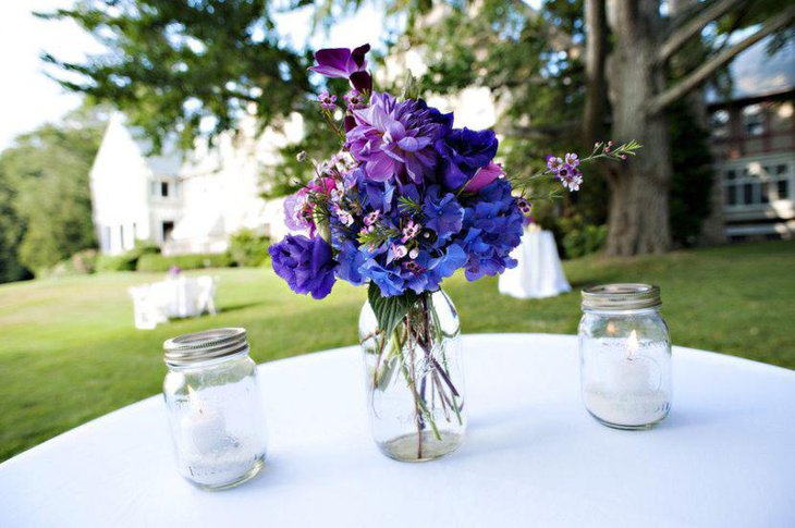 Attractive purple floral centerpiece for wedding table