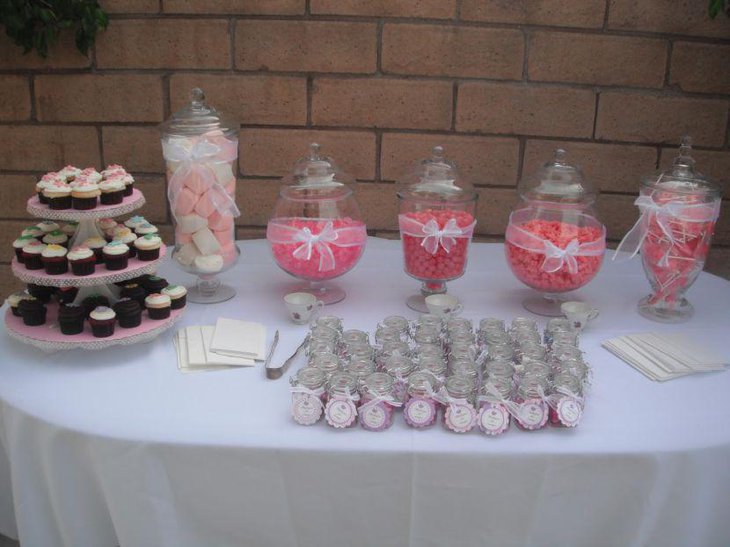 Baby pink accented baby shower candy table decor