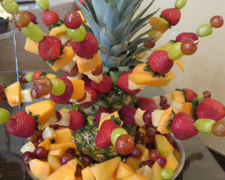 Baby shower fruit centerpiece with strawberries pawpaws grapes and pineapple