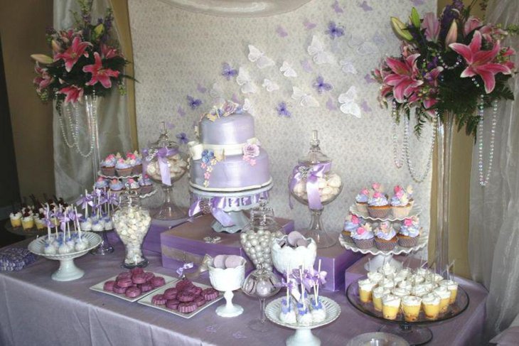 Beautiful butterfly themed purple wedding candy table