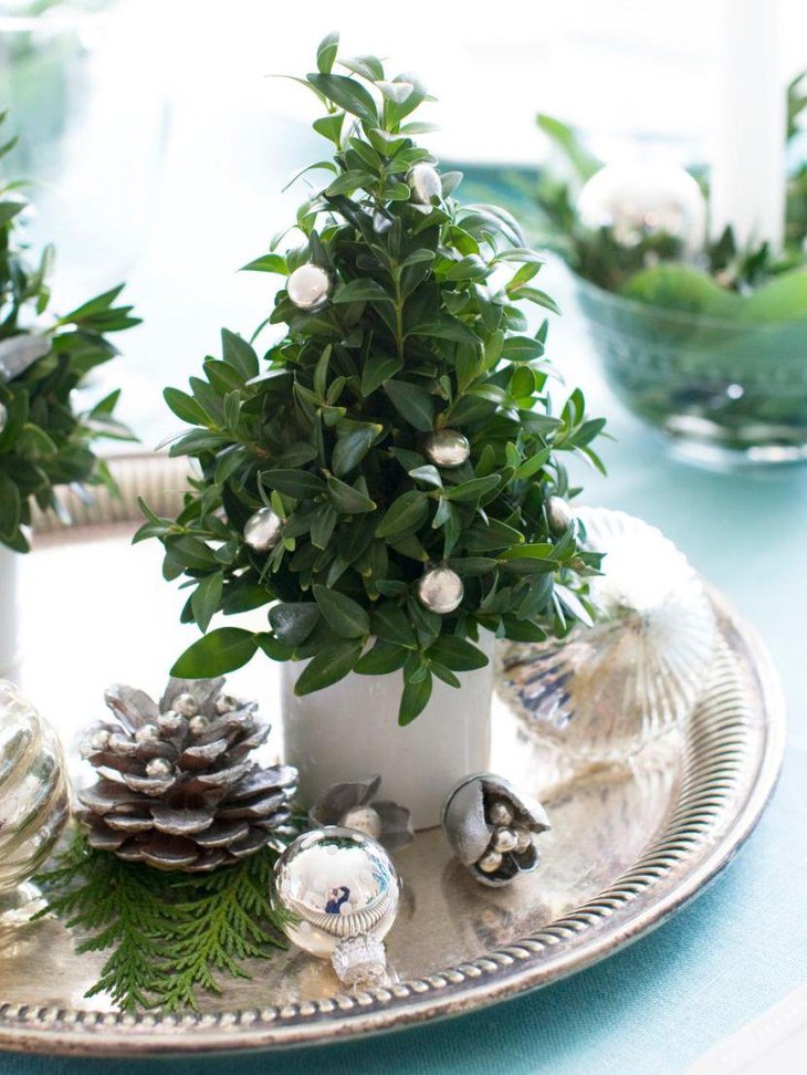 Beautiful Christmas vignette with silver pine cone and balls