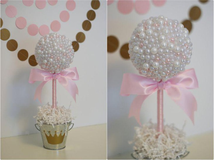 Beautiful jewel and pearl centerpiece in a tiara printed silver bucket