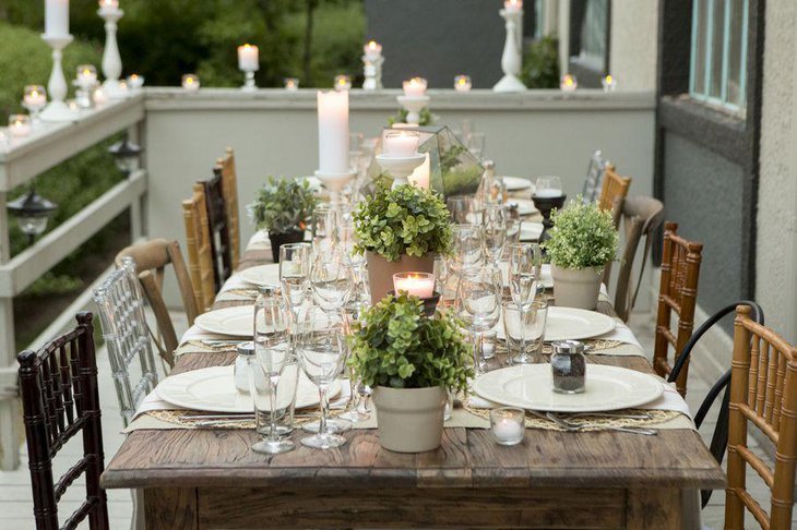 Beautiful outdoor dinner party table setting with rustic and natural elements