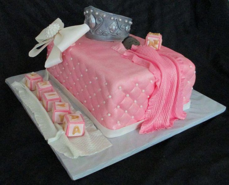 Beautiful princess theme fondant cake for baby shower with quilt and crown detailing