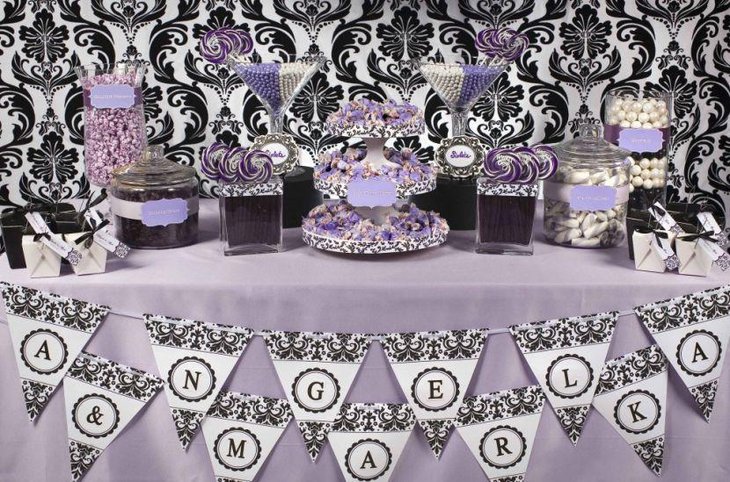 Beautiful purple and white wedding candy bar decor