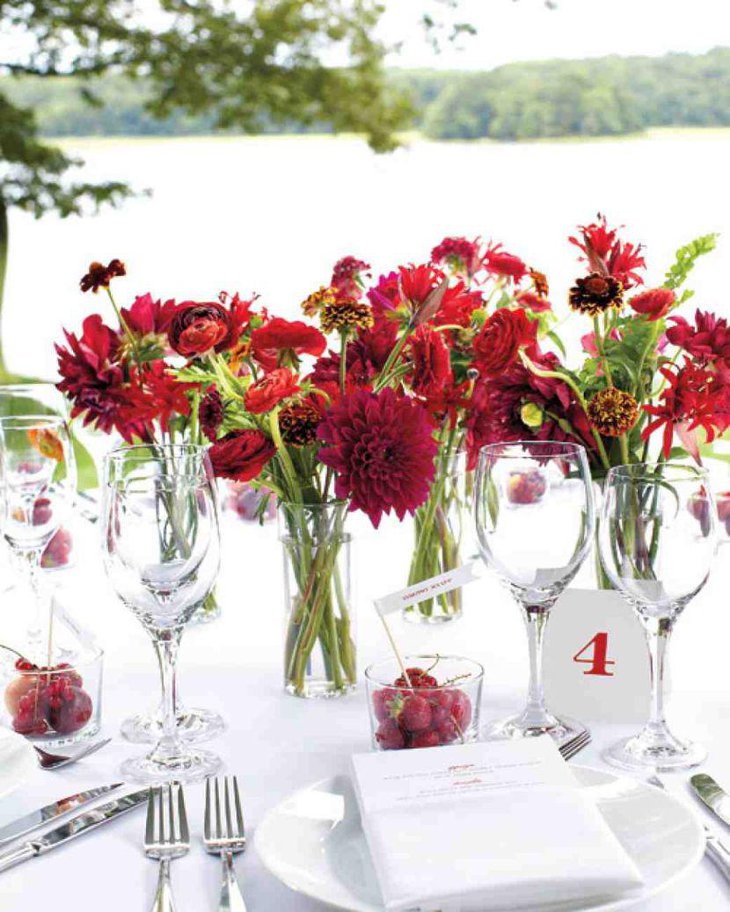 Beautiful red floral summer wedding table centerpiece