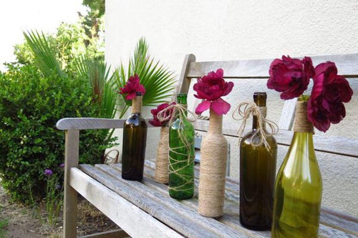 Beautiful Twine Wrapped Wine Bottle Centerpieces With Red Flower Arrangement