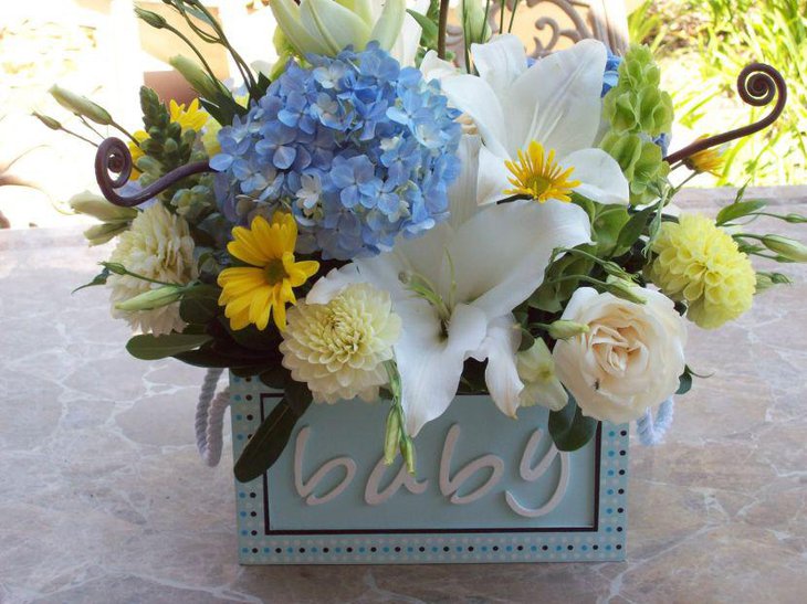 Beautiful yellow and grey flower decoration for baby shower