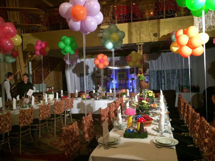 Birthday party table decor with flowers and mushroom