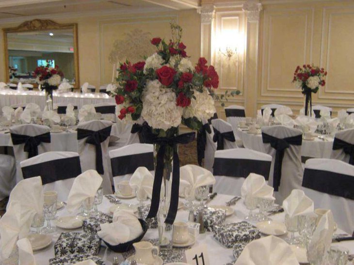 Black And White Wedding Table Setting Using Large Flower Decor