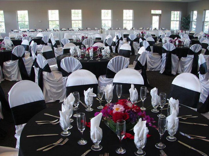 Black and white wedding table with colourful flower decoration