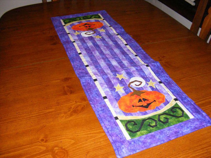 Blue quilted Halloween pumpkin table runner