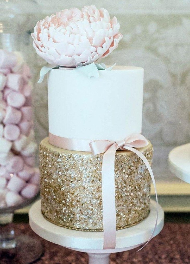 Blush and gold cake decor on dessert table