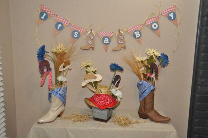 Boy baby shower decorations with boots and cowboy hats