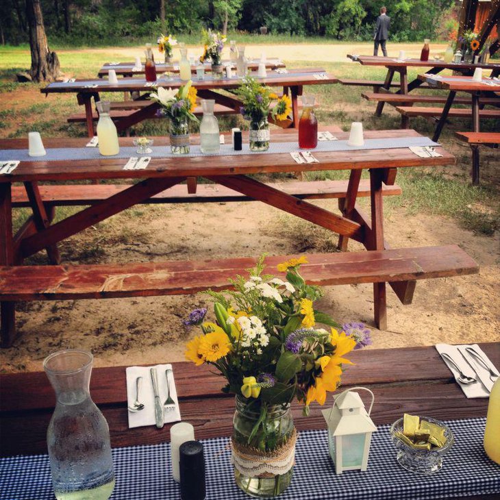 Bright yellow and white floral decor on bridal shower tables