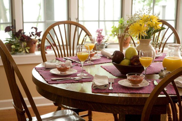 Bright yellow floral arrangement on Italian themed table 1