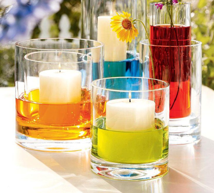 Candles in colored water for centerpiece for summer garden party